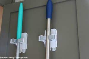 Organize brooms and mops with a command strip broom gripper