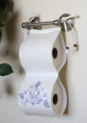 Store extra toilet paper rolls with this handmade solution.