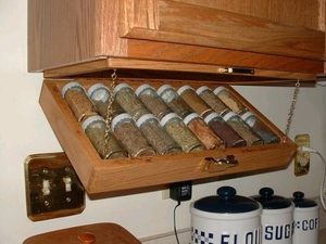 RV space solutions: Fold-out spice rack installed under a cupboard