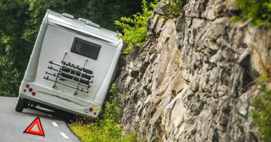 camper with flashers on and hazard sign